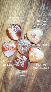 small red carnelian agate hearts engraved with henna designs